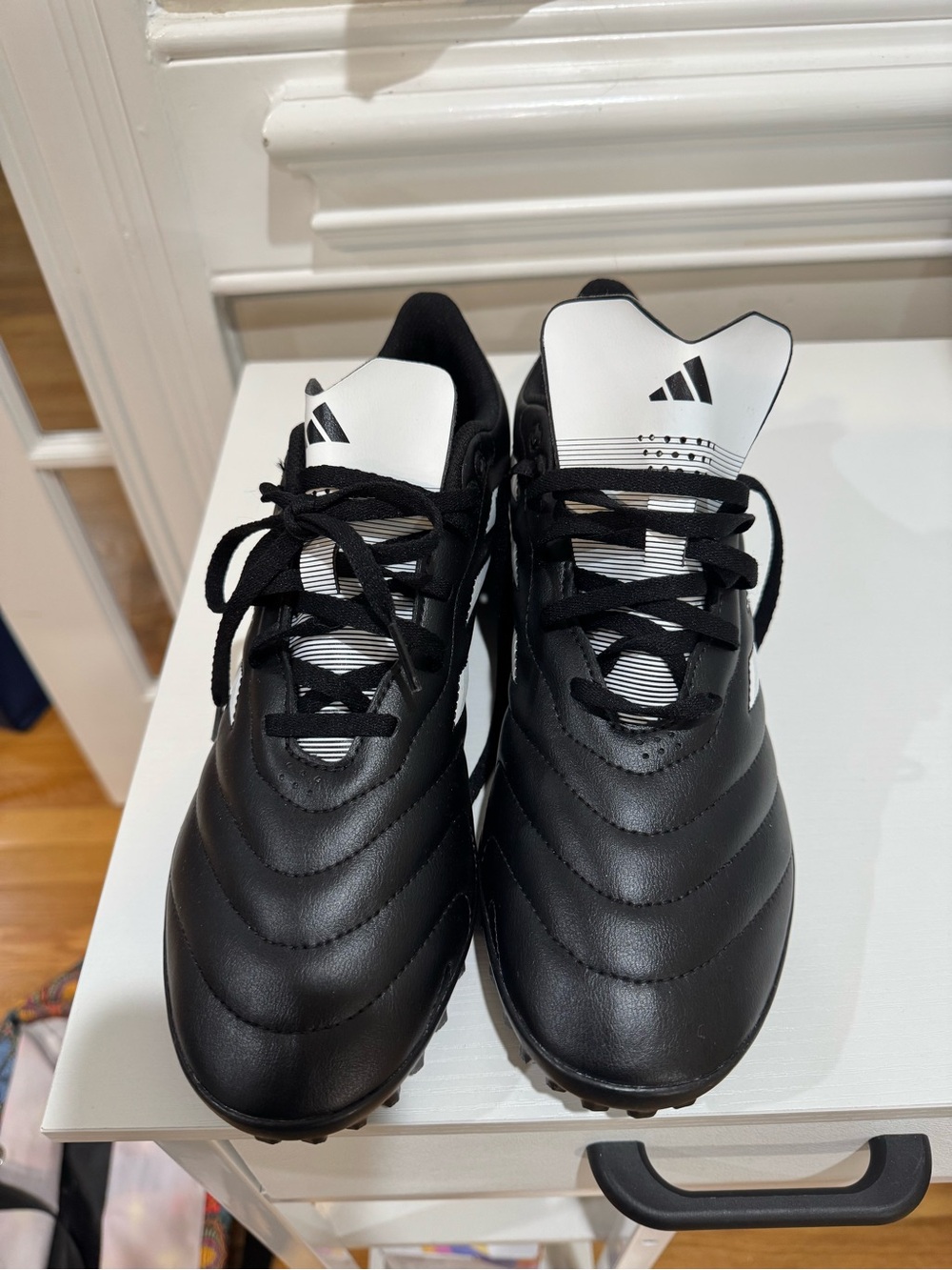 adidas Black Low-Top Athletic Cleats with White Logo Accents